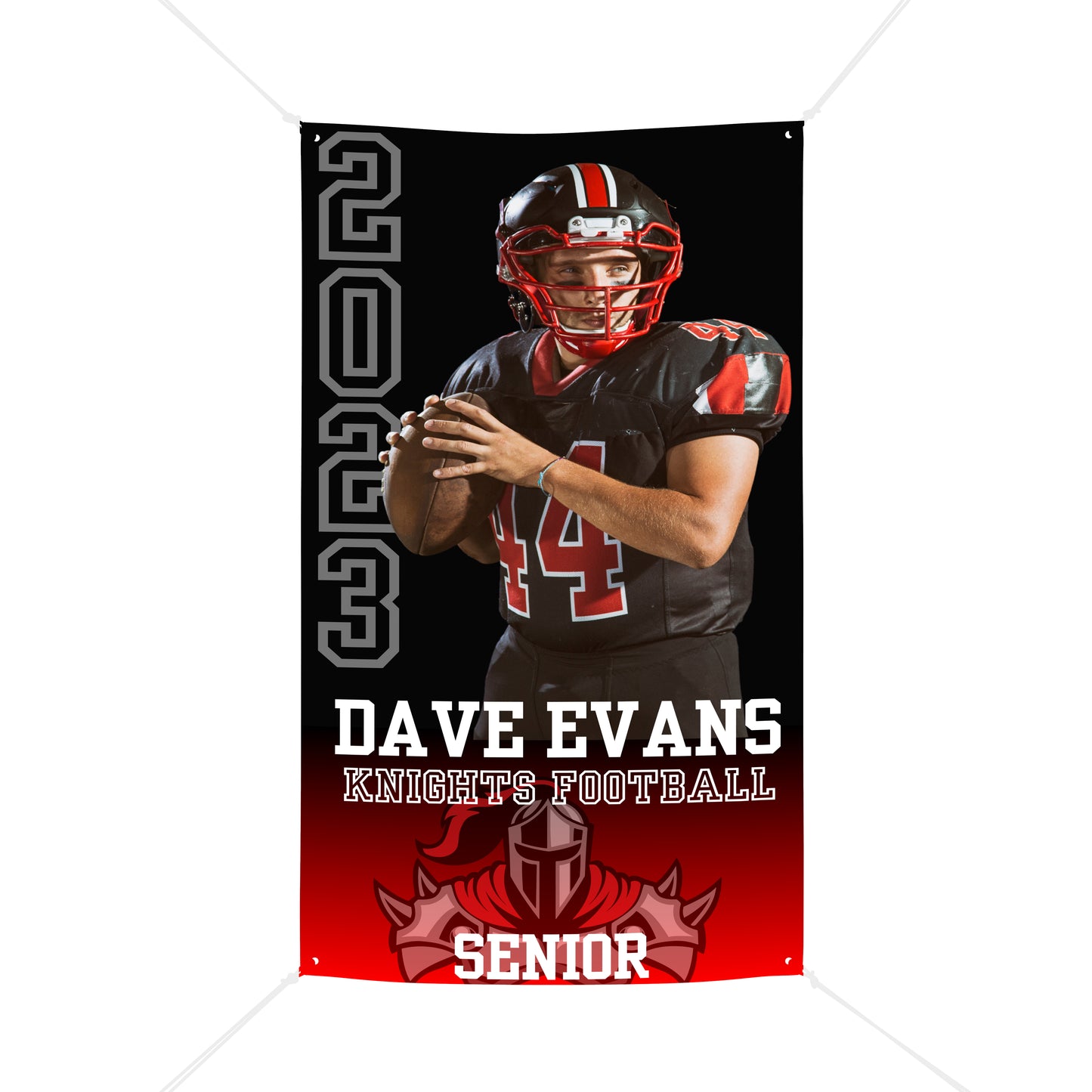 A red and black sports banner announces the senior varsity football player Dave Evans. The banner has a picture of him in his uniform holding a football on the top 2/3 of the banner. The bottom third of the banner shows the knights football mascot in red.